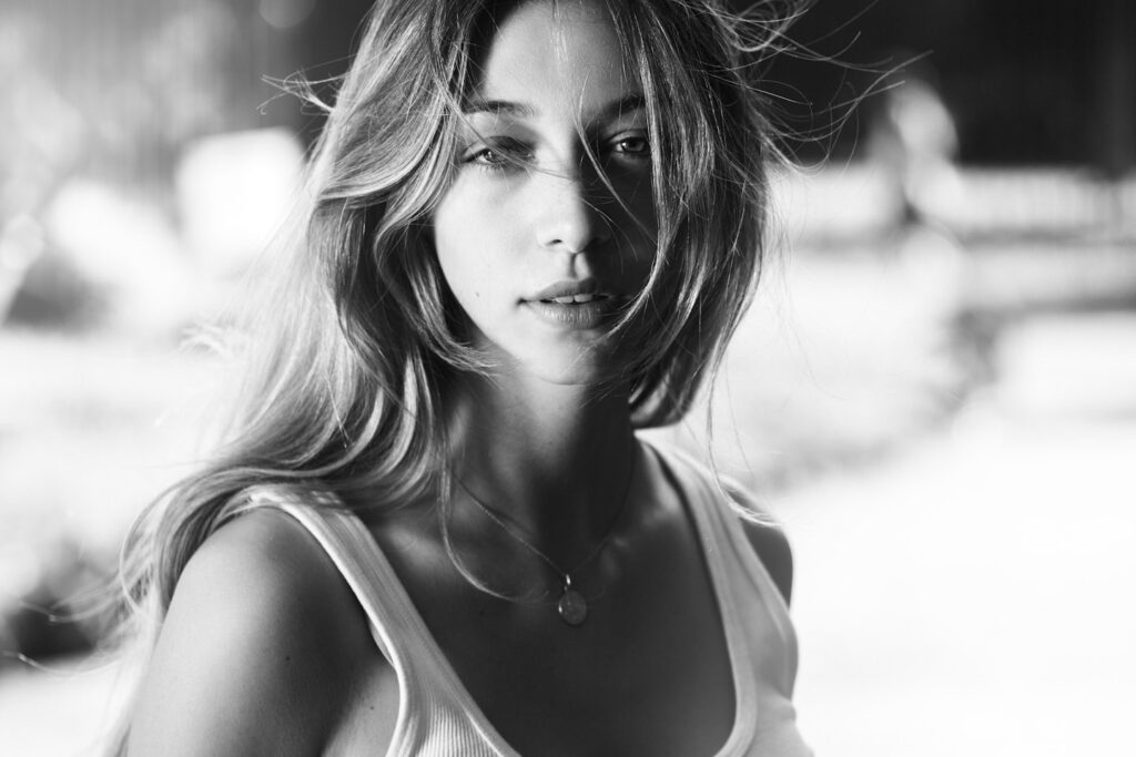 a black and white photo of a woman with long hair